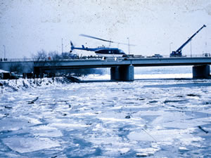 helicopter over ice covered river
